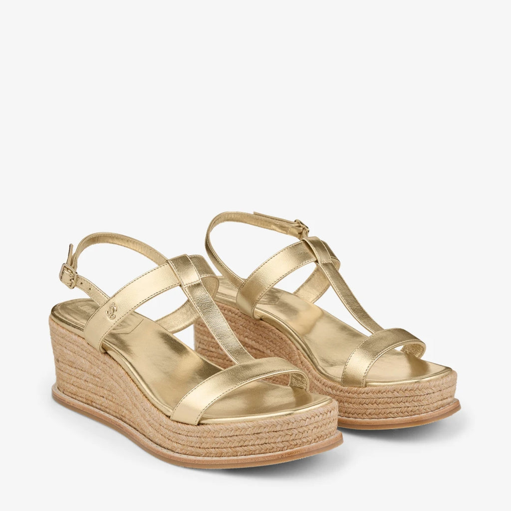 Sandalias de cuña de cuero metálico dorado
