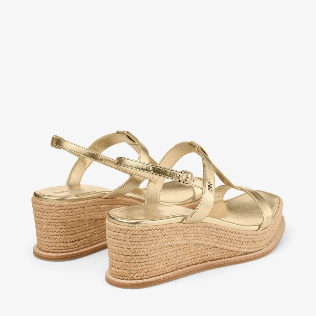 Sandalias de cuña de cuero metálico dorado