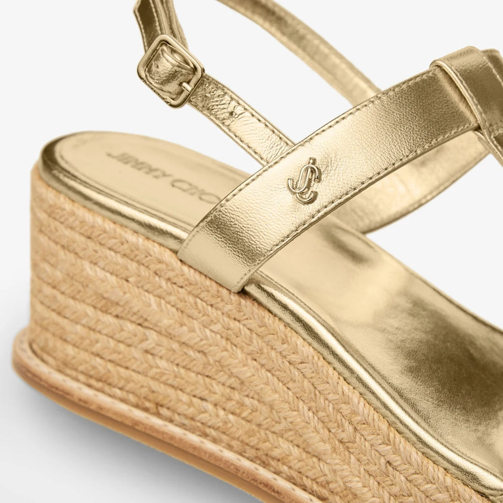 Sandalias de cuña de cuero metálico dorado