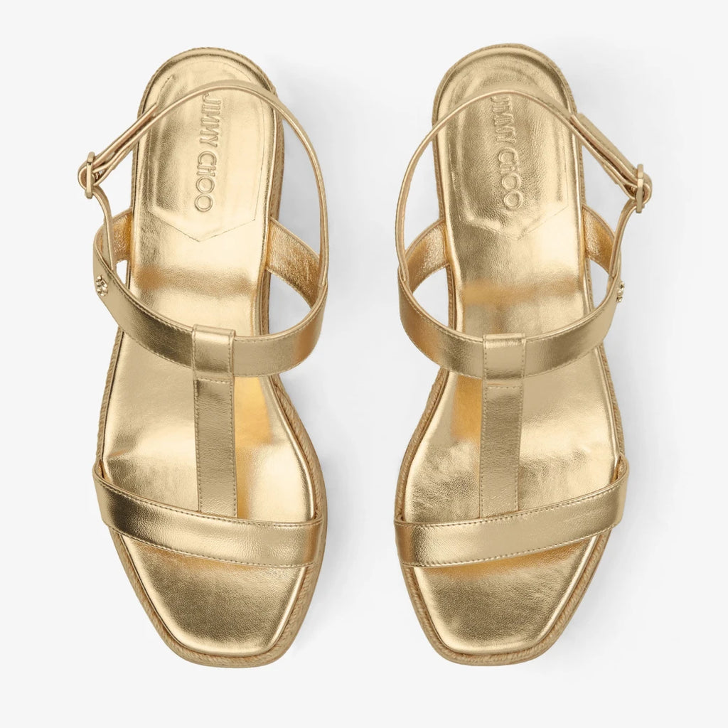 Sandalias de cuña de cuero metálico dorado